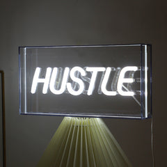 Neon Bliss LED shaped light displaying 'PEACE'