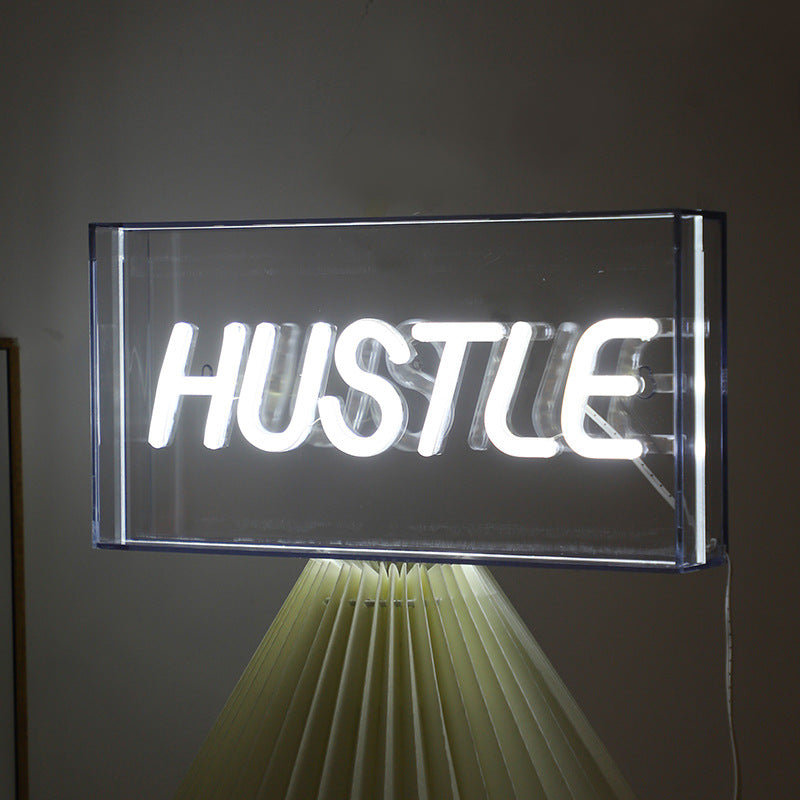 Neon Bliss LED shaped light displaying 'PEACE'