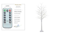 Illuminated LED birch tree light in night setting