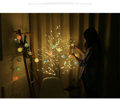 Illuminated LED birch tree light in night setting