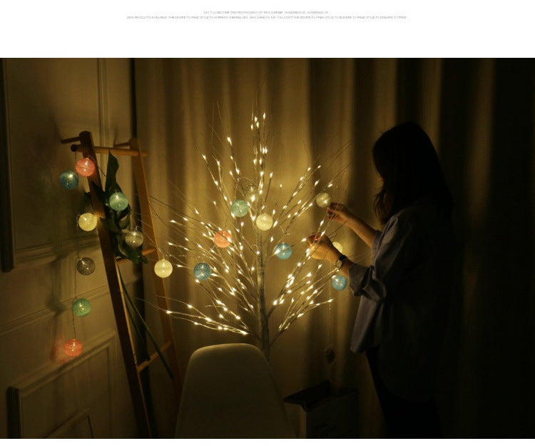 Illuminated LED birch tree light in night setting