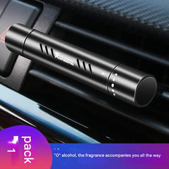 Clip attached to vehicle air vent displaying scent option