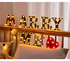various letter lights in gold and white