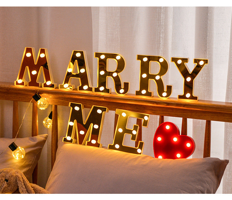 various letter lights in gold and white