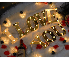 various letter lights in gold and white