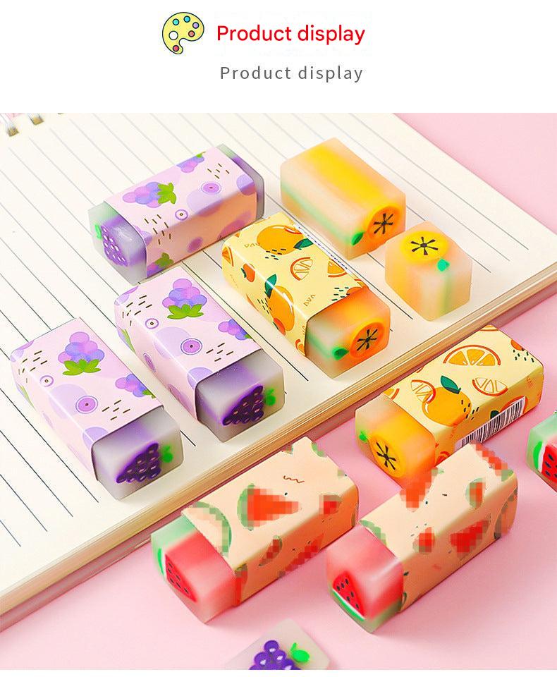 assorted fruit-themed erasers on a desk