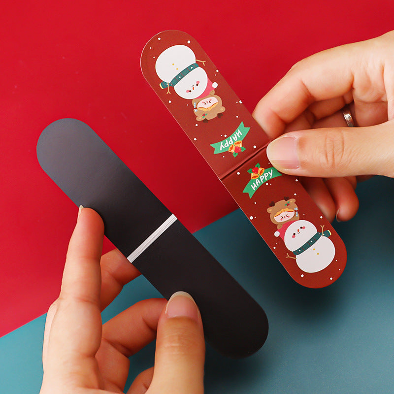 Magnetic bookmark featuring holiday gifts