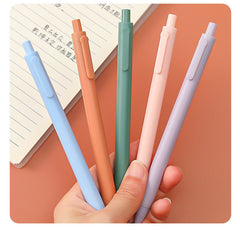 Chic macaron coloured gel pens displayed on desk
