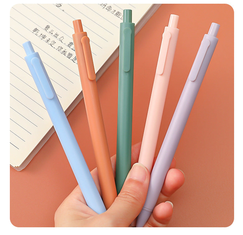 Chic macaron coloured gel pens displayed on desk