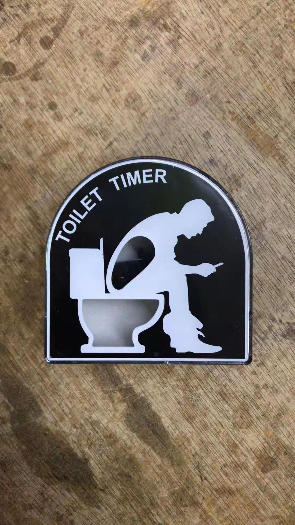 Toilet-Shaped Timer on Bathroom Counter