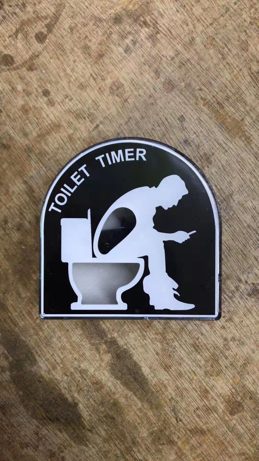 Toilet-Shaped Timer on Bathroom Counter