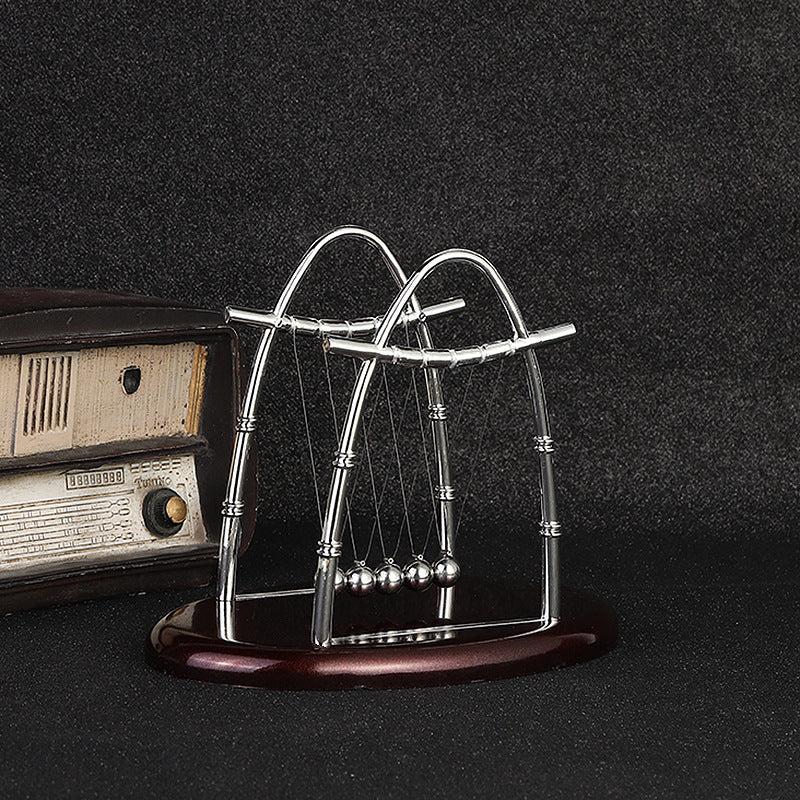 Kinetic Newton's Cradle with red base displayed
