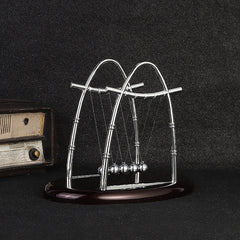 Newton's Cradle desk toy showcasing motion