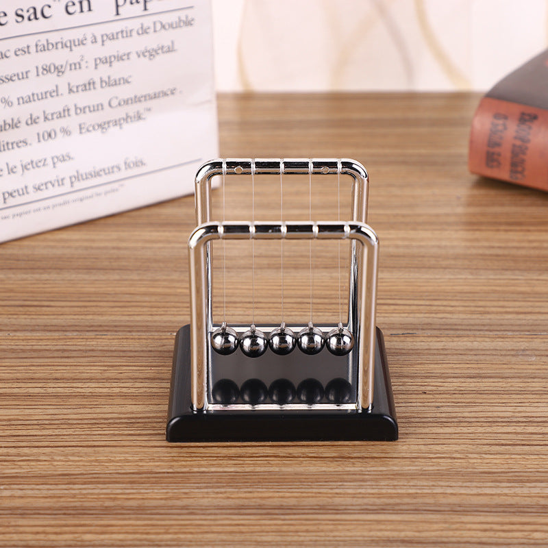 Kinetic Newton's Cradle with red base displayed