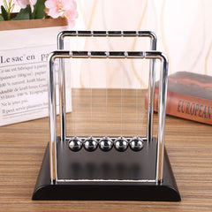 Kinetic Newton's Cradle with red base displayed