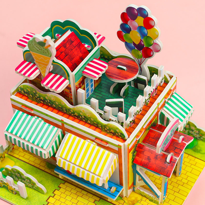 Child playing with 3D Ice Cream Shop puzzle