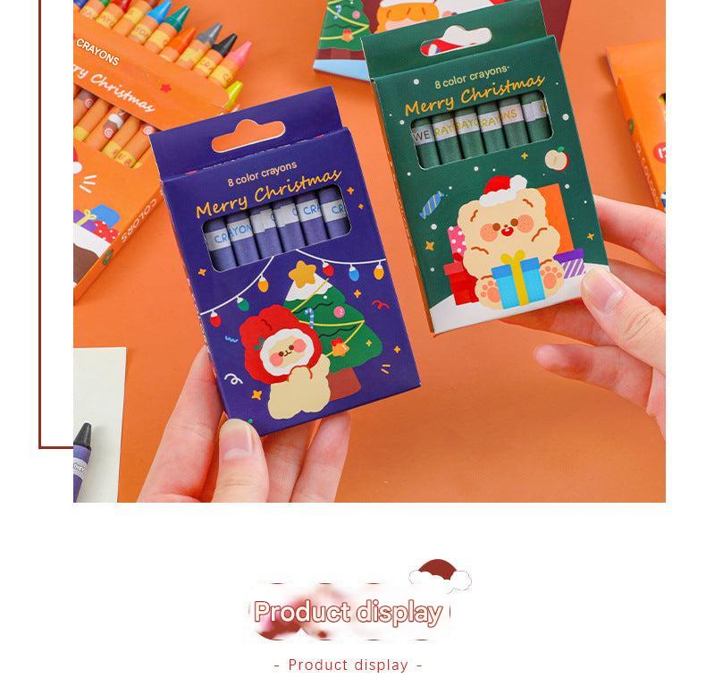 Kids Christmas crayon set featuring cartoon designs
