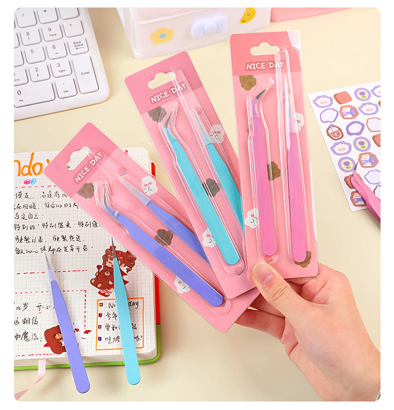 Craft tweezers holding paper with detail