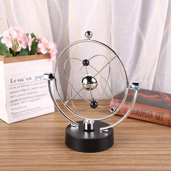 close up of swinging sticks on Newton Pendulum