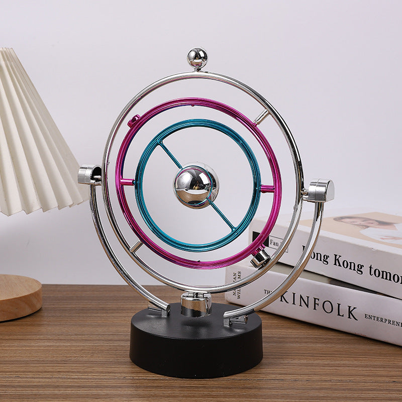 view of electroplated kinetic sculpture on desk