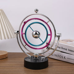 view of electroplated kinetic sculpture on desk