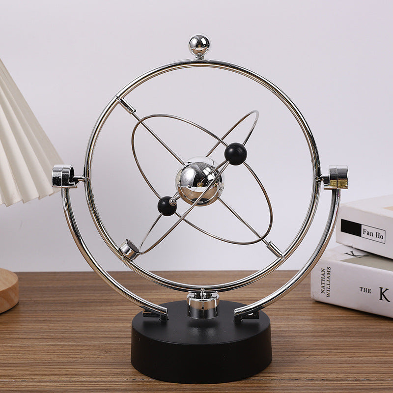close up of swinging sticks on Newton Pendulum