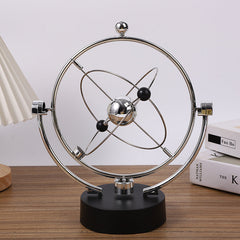 close up of swinging sticks on Newton Pendulum