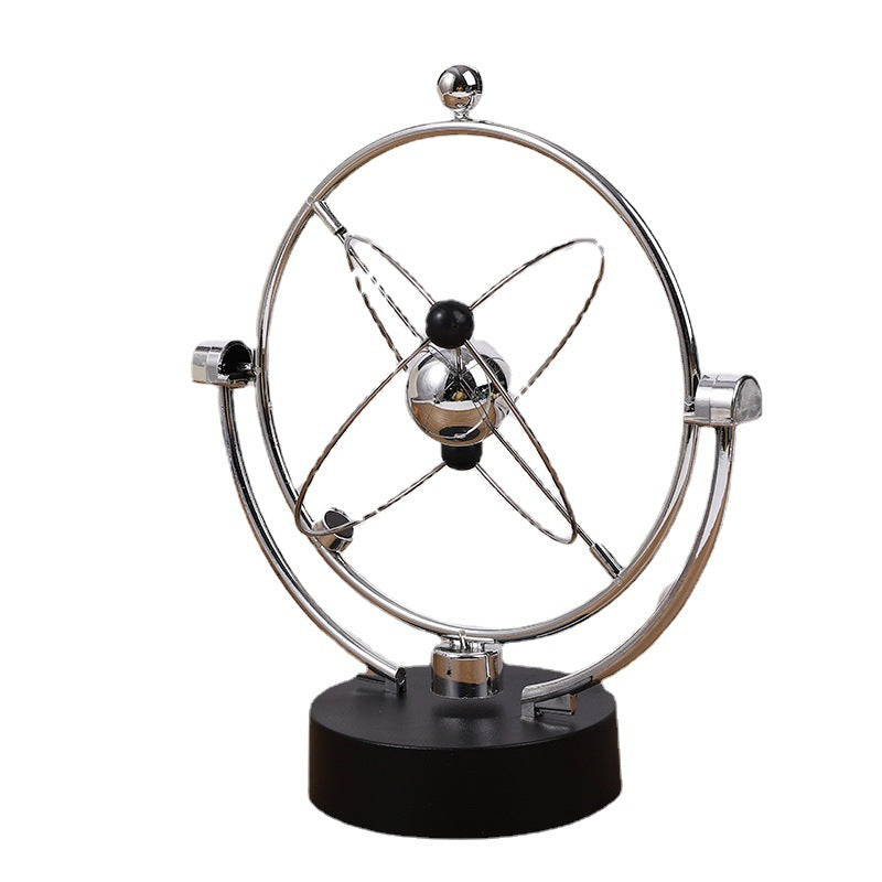 view of electroplated kinetic sculpture on desk