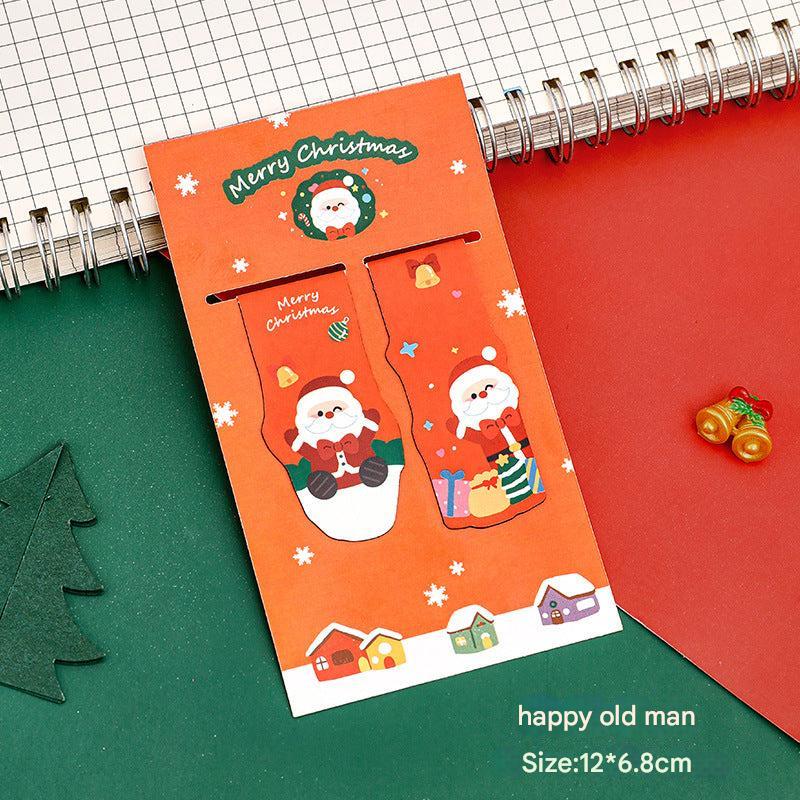 Close-up of Christmas magnetic bookmarks on a table