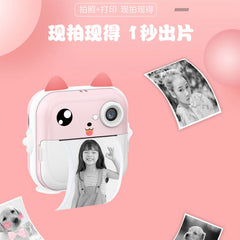 Child holding a blue mini camera