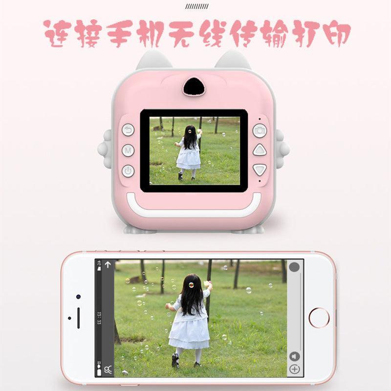 Child taking a photo with a mini camera
