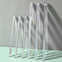 student using acrylic triangular ruler on desk