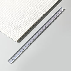 clear acrylic ruler showcasing various scales