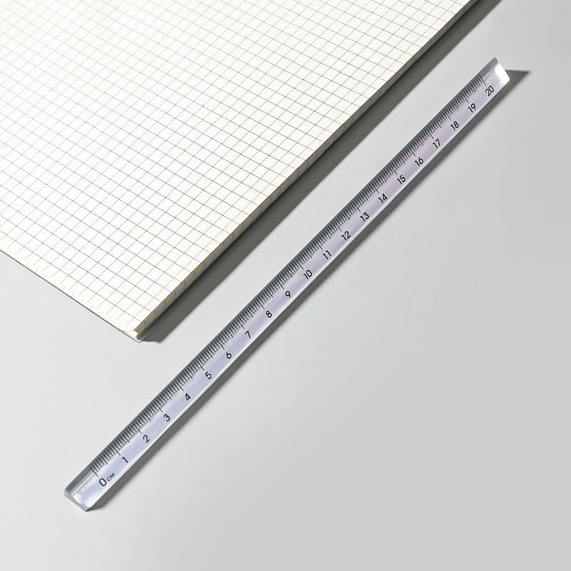 clear acrylic ruler showcasing various scales
