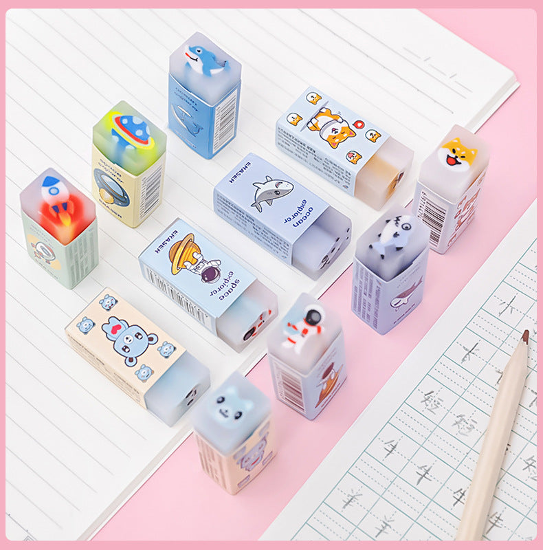 Astronaut-themed eraser shown in a classroom setting
