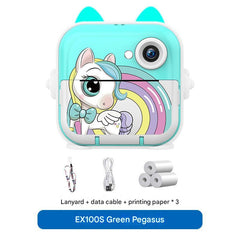 child using green digital instant print camera