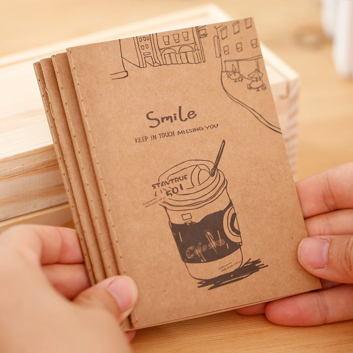 open kraft notebook with glasses on the side