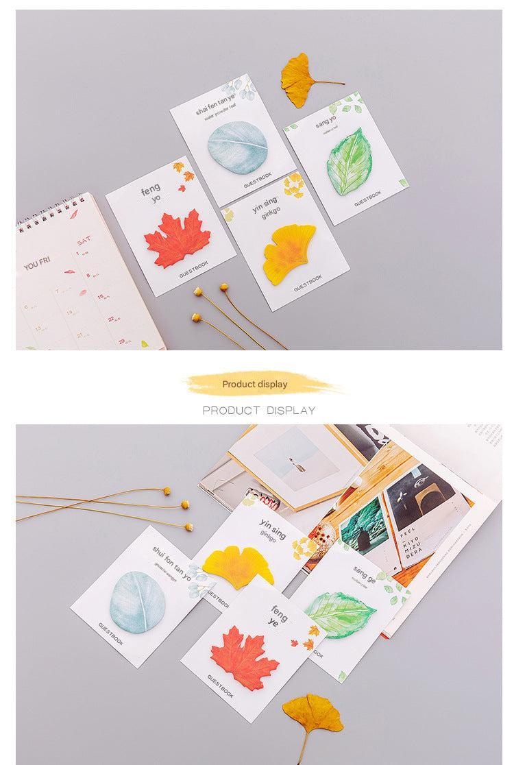 Leaf sticky notes on a desk surface