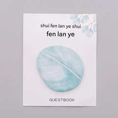 Close up of leaf-shaped sticky note pad