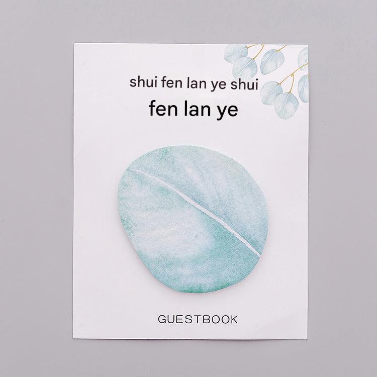 Close up of leaf-shaped sticky note pad