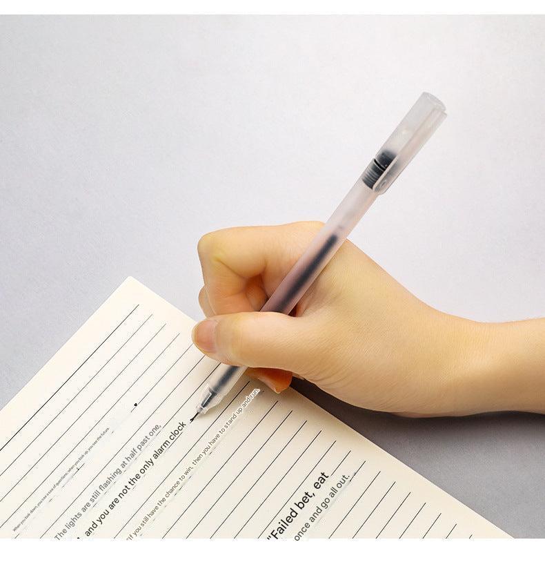 black gel pen held in hand for writing