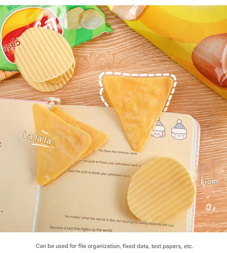 colourful triangle bag clips on table