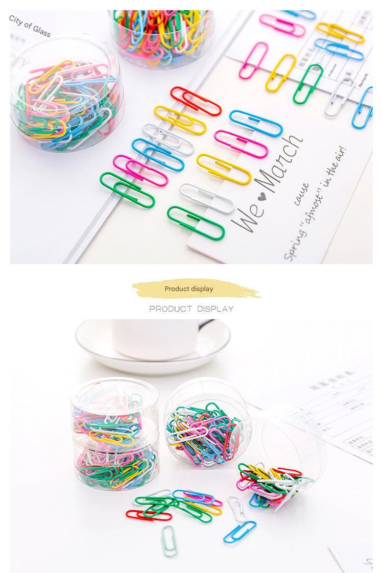 Colourful binder clips isolated on white