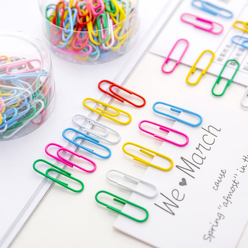 Collection of vibrant paper clips on desk