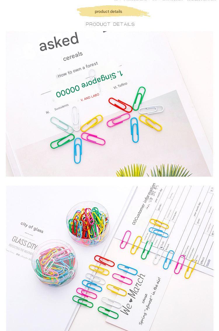 Vibrant multi-colored paper clips spread out