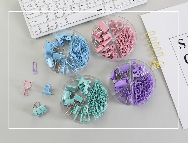 Metal binder clips in various colours arranged