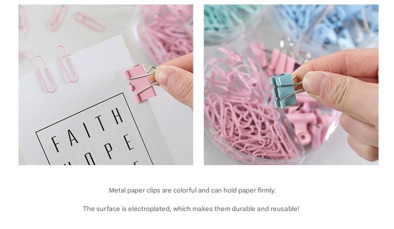 Mixed coloured binder clips on a table
