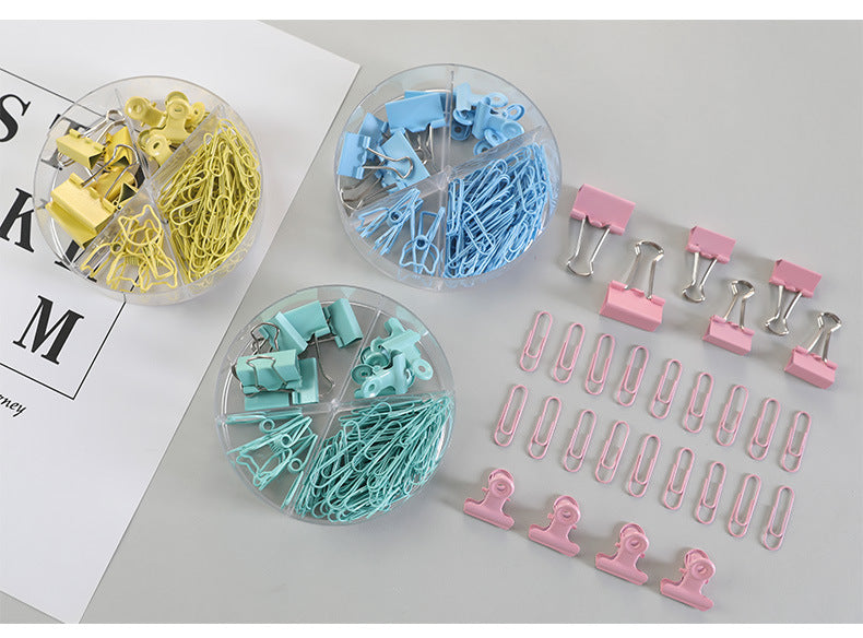 Close-up of vibrant pink and blue binder clips