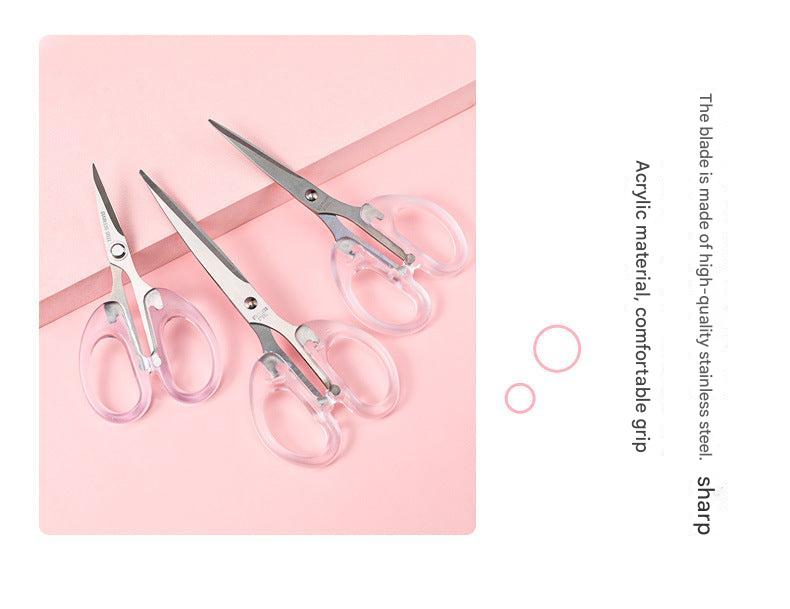 detail view of stainless steel scissor blades clear handle
