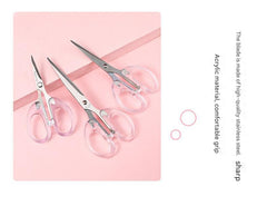 detail view of stainless steel scissor blades clear handle